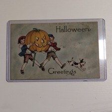 Vintage Halloween Post Card - Boy & Girl Carrying Jack O' Lantern picture