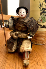 ANTIQUE JAPANESE SAMURAI DOLL HOLDING FLAG. picture