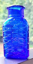 ANTIQUE COBALT BLUE GLASS POISON BOTTLE WITH EMBOSSED DIAMOND PATTERN & LETTERS picture