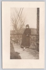 RPPC Woman Decorative Hat Coat Leaning Against Iron Bridge Real Photo Postcard picture