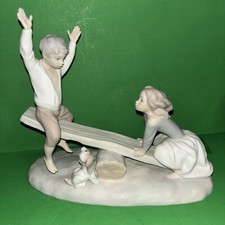 NAO Lladro Spain Bisque Porcelain Boy and Girl on Seesaw with Dog picture