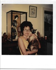 Vintage instant color Polaroid photo Asian woman holding Siamese cat picture