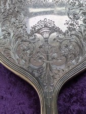 Vintage Silver Hand Mirror with Etched Flower Basket and Scrolls Design picture