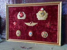 Soviet emblem framed display vintage Cold War memorabilia USSR military hat pins picture