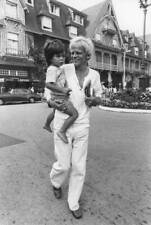 Klaus Kinski carrying his son Nikolai in his arms on September 8, - Old Photo picture
