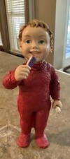 Vintage Boy Dressed In red Outfit Holding Toothbrush And Toothpaste. picture