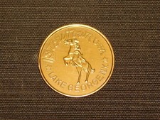 VINTAGE 1960-70S STORYTOWN GASLIGHT VILLAGE LAKE GEORGE NY SOUVENIR METAL COIN picture
