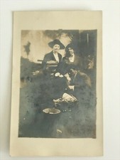 Postcard RPPC Real Photo Two Couples Posing With A Sack c1910's picture