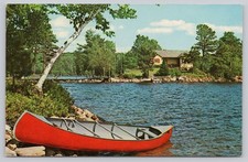 Vintage 1972 Red Canoe Lakeside Cabin Scenic Postcard A Peaceful Vacation picture