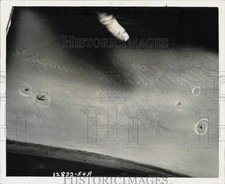 1954 Press Photo Tire from a taxi that traveled 30,000 miles with nail holes picture