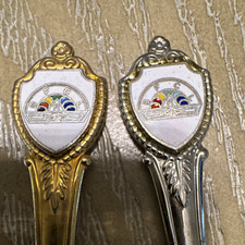 Lot of 2 Vintage Novelty Souvenir Spoons Shield Crest Handle Silver & Gold picture
