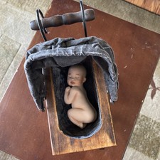 Vintage Baby Carriage With Baby Doll In The Carriage. picture
