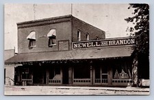 J98/ Osseo Wisconsin Postcard c1910 Newell and Brandon Store 473 picture