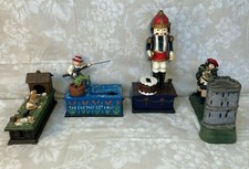 4 Vintage Cast Iron Reproduction Coin Banks Nicely Painted and Decorated picture