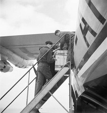 Personnel loading parcels luggage into hold of an aircraft Marigna- Old Photo 1 picture