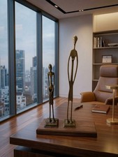 Vintage Brass/Bronze Elongated Tall African Man & Woman Tribal Sculptures picture