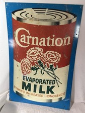 Vintage Carnation Evaporated Milk Tin Metal Tacker Sign Made In USA Advertising picture