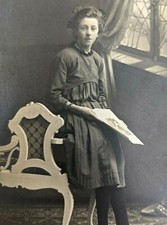 VTG Real Photo Postcard RPPC Girl Holds Paper Leaning on Victorian Bench 1890s picture