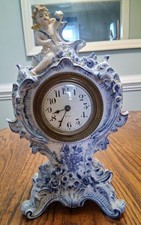 19th Century French Faience Mantel Clock with Cherub picture