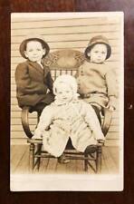 Vintage RPPC Real Photo Postcard - Three children posing on chair c.1900s-1910s picture