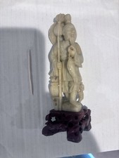 Hand Carved Soapstone Of Man And Fish picture