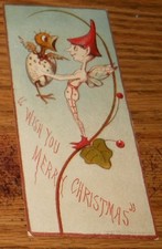 Victorian Trade Card Baby Bird in Egg Held by Boy w/Wings Hat Merry Christmas picture