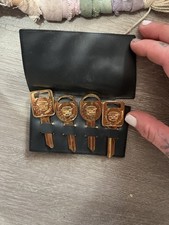 vintage 24k gold-plated GM/Cadillac key blanks stored in a black case picture